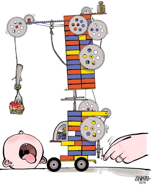 Baby being fed using a lego construction.