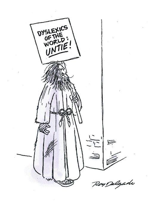 Man Holding Sign: 'Dyslexics of the World Unite.'