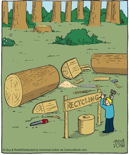 A Recycling Sign Made Out Of A Felled Tree.