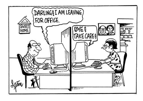 Married couple communicating via e-mail at home