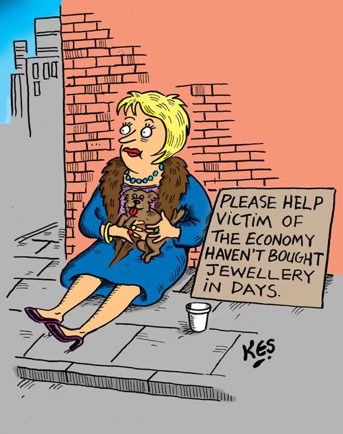 A wealthy looking woman sits near sign: 'Please help victim of the economy haven't bought jewellery in days.'