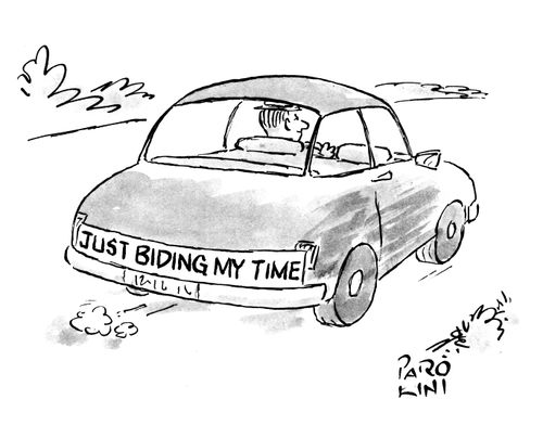 Car has 'Just biding my time' written across the back as single man drives.