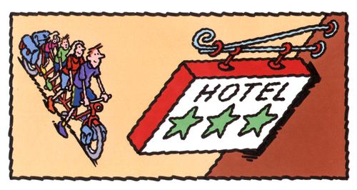 Family of cyclists arriving at a hotel.