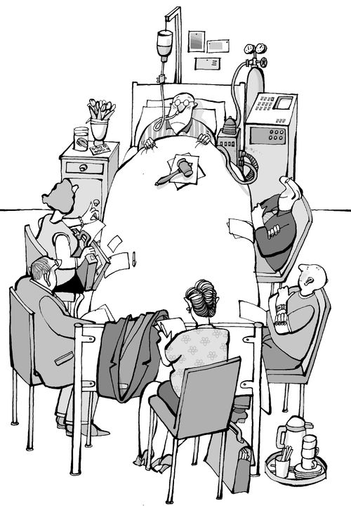 Board meeting taking place at a hospital bed.