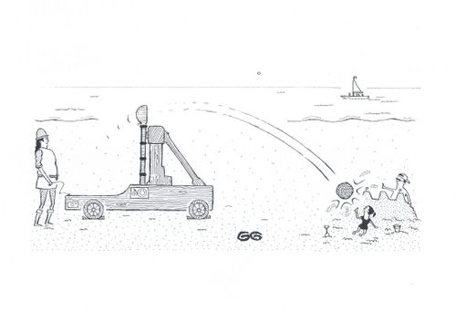 Medieval catapult on beach smashing sandcastle.