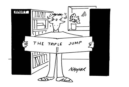 Man looking at book about Triple Jump.