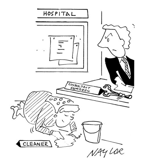 Cleaner with nameplate next to Consultant Surgeon's desk.