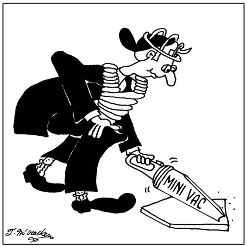 An umpire vacuum's home plate.