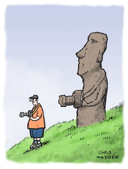 An Easter Island statue with a camera (showing how tourism affects the destinations of the tourists).
