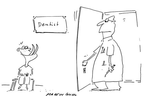 Boy with fangs at the dentist