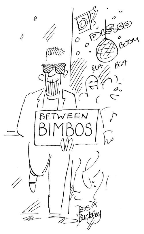 Man in a disco carrying a 'between bimbos' sign.