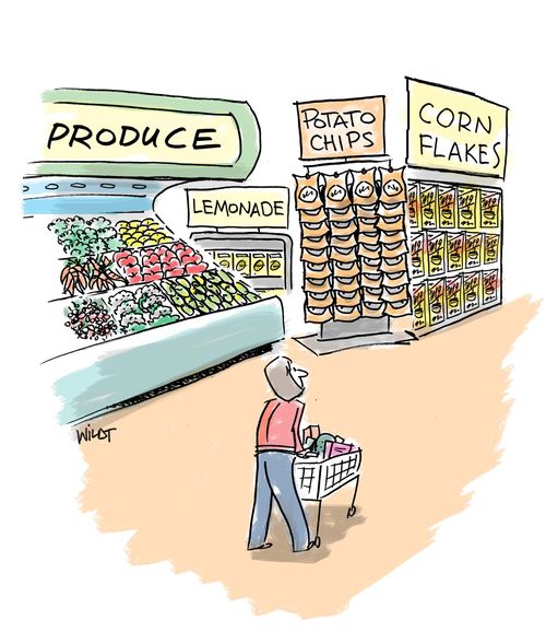 Junk food is placed near produce section in grocery store.