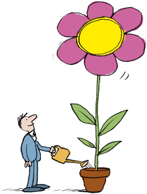 man watering giant flower
