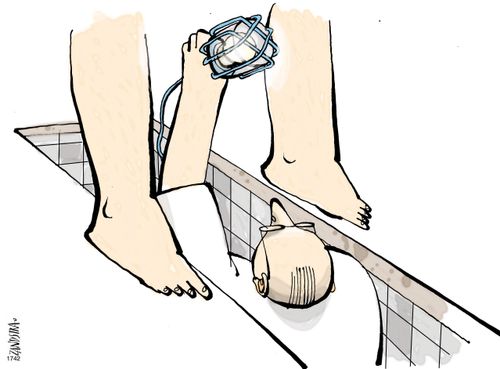 Gynaecologist standing under a patient (like a mechanic).