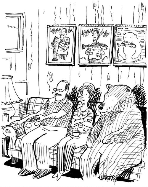 Fishing family, including a bear, sitting on the sofa.