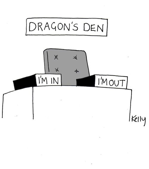 Dragon's den desk. 'I'm in' and 'I'm out' tray on desk.