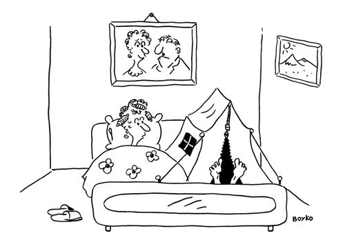 Husband sleeps in a tent next to his wife in the family bed