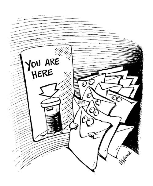 Letters in post-box with sign 'you are here'.