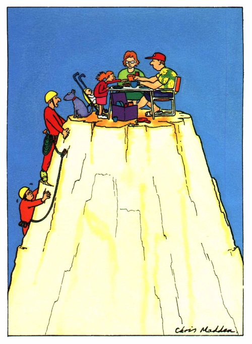 Mountain climbers find a family picnicing on top of the mountain