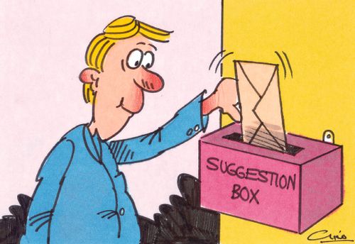 Blonde man putting an envelope into a suggestion box