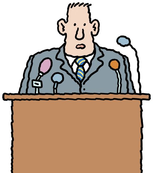 An official making a speech at a press conference.