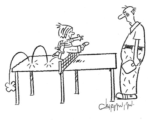 Child jumping on a table-tennis table.