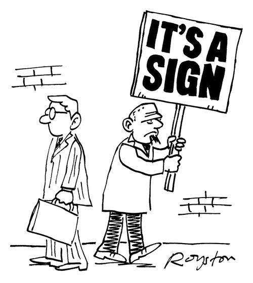 Placard reads: 'It's a sign'.