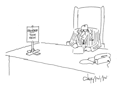 Sign on desk reads: Danger - Thin Skin.
