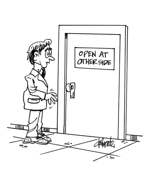 Man sees a sign on a door - Open At Other Side.
