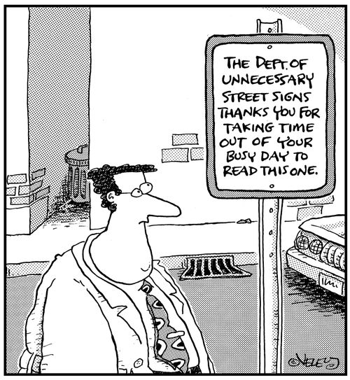 Street sign: 'The Department of Unnecessary Street Signs thanks you for taking time out of your busy day to read this one.'