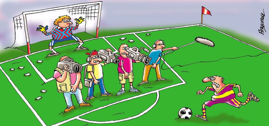 Footballer About to Take a Penalty With Camera Crew In Front of Goal.