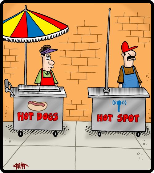 Hot dog cart next to a hot spot cart.