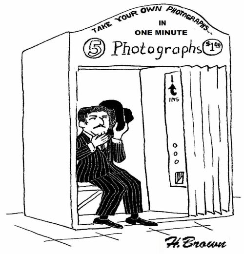 Shy man in a photograph booth.