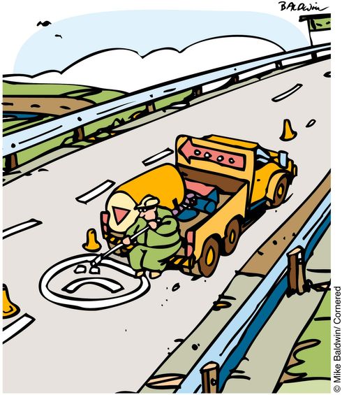 Bored road worker painting a smilie face