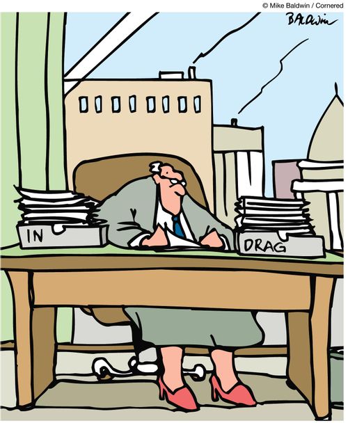 Man wearing skirt and women's shoes has filing trays marked 'in' and 'drag'.