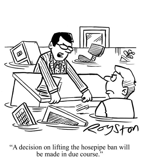 Official in flooded office says: 'A decision on lifting the hosepipe ban will be made in due course.'