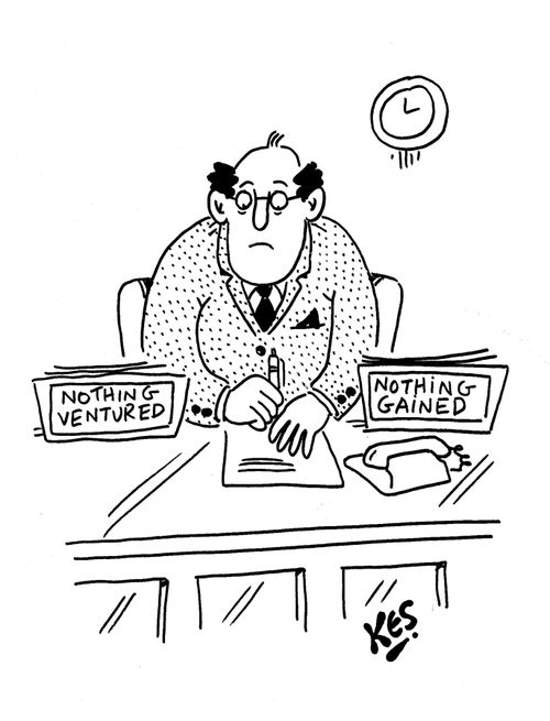 Man sits at desk with workboxes: Nothing ventured/ Nothing gained.