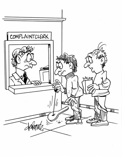 A man at a complaint clerk uses a paddle ball by holding the ball.