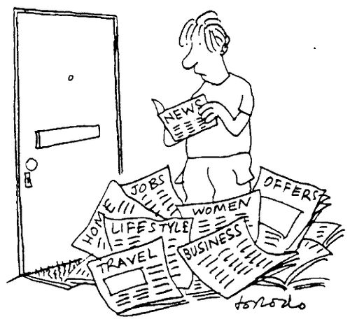 Man looking through a huge pile of 'sections' from a paper to get to the tiny news bit