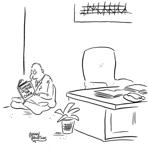 Business man reading 'Thinking Outside the Chair'