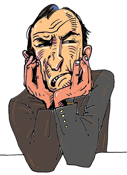 Man with head in hands.