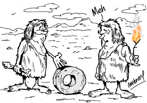 Caveman showing off wheel to unimpressed caveman with fire.