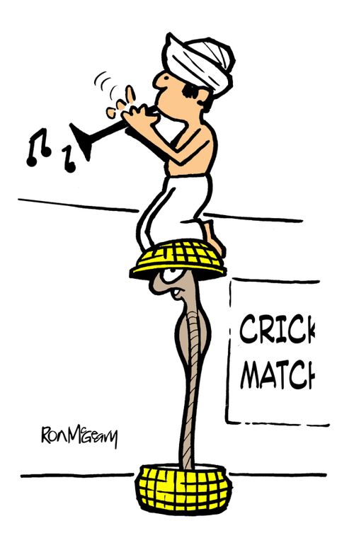 Indian snake charmer at cricket match.