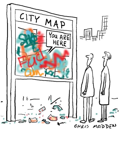 Graffiti on map of city. Map has arrow saying 'You Are Here', implying that the observers are in a defaced and vandalized area.