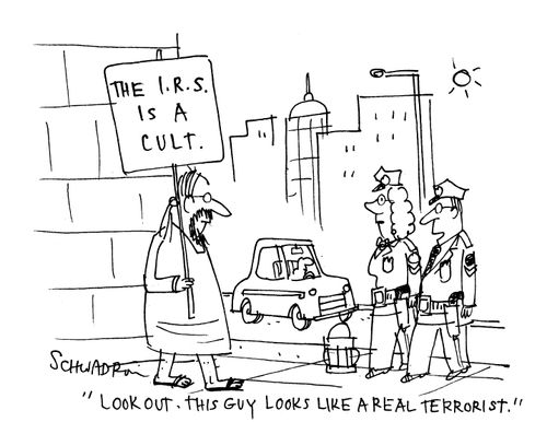 Man holding a sign saying 'The IRS is a cult.' Police comment; 'Look out. This guy looks like a real terrorist.'