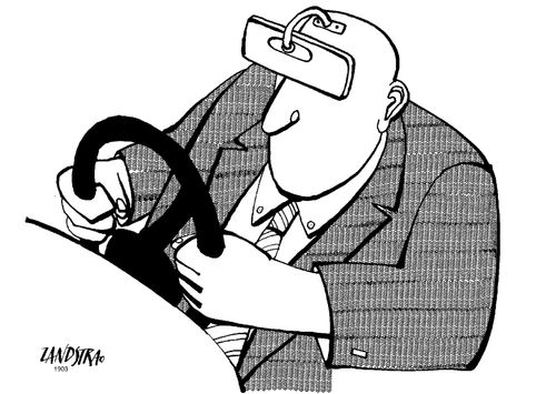 Driver with a rear view mirror attached to his forehead.