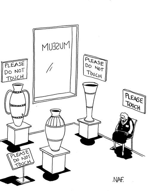'Please do not touch' signs all over a museum.  The guard has a 'please touch' above her.