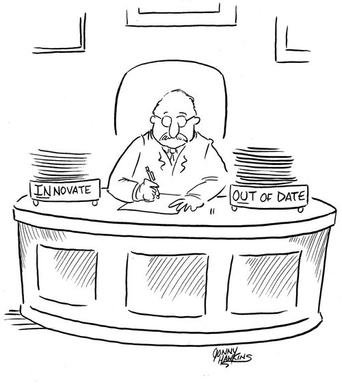 Businessman with two boxes: 'Innovate' and 'Out of Date'