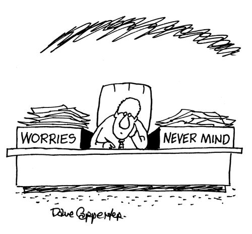 Man with desk organisers labelled: 'Worries' and 'Never Mind'.