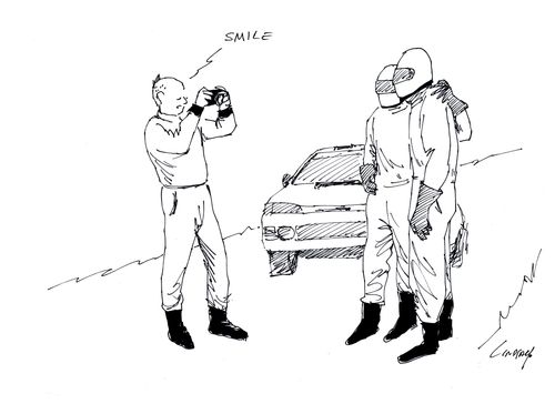 Photographer says 'smile' to two men in helmets.
